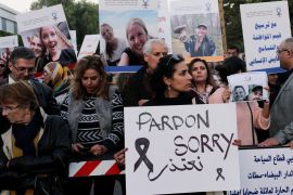 Moroccans gather in front of Denmark's embassy in Rabat to honour Maren Ueland from Norway and Louisa Vesterager Jespersen from Denmark, who were killed in Morocco, in Rabat, Morocco December 22, 2018. The placard reads