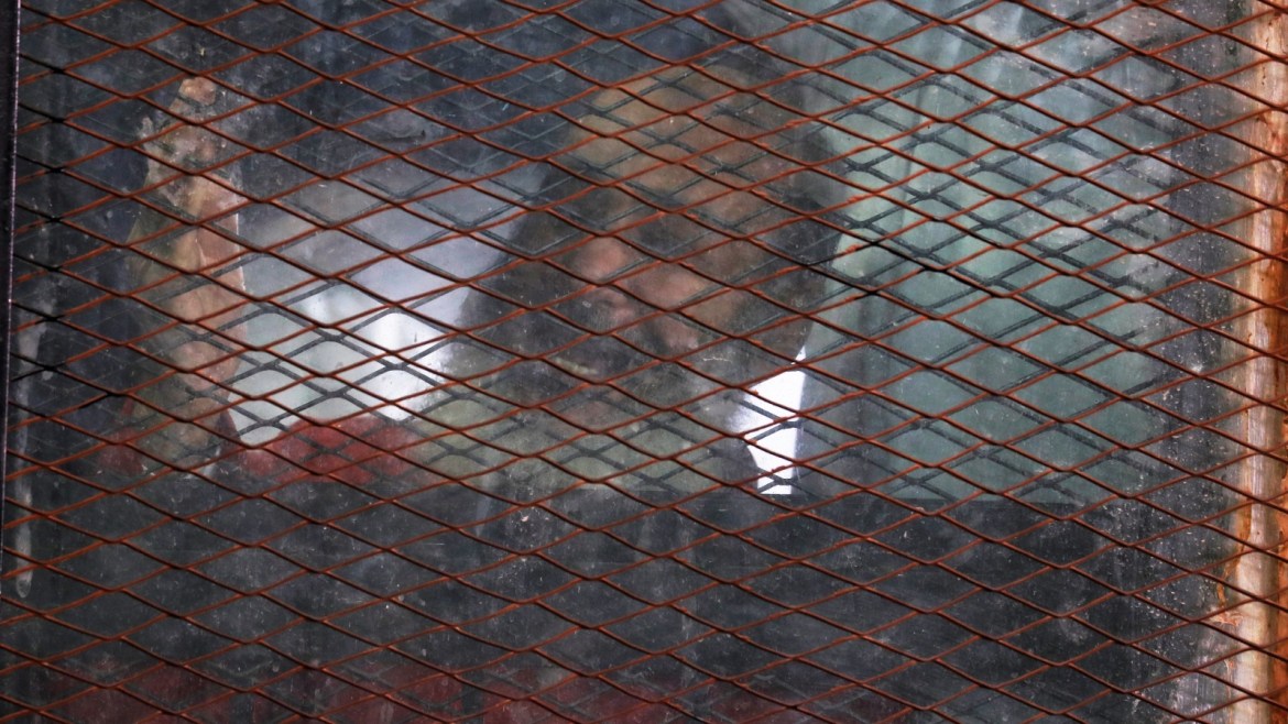 Islamist cleric Safwat Hegazis is seen behind the bars during a court case accusing ousted Islamist president Mohamed Mursi of breaking out of prison in 2011, in Cairo, Egypt, December 26, 2018. REUTERS/Amr Abdallah Dalsh