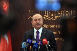 Turkish FM Cavusoglu in Tunisia- - TUNIS, TUNISIA - DECEMBER 24: Turkish Foreign Minister Mevlut Cavusoglu and Tunisian Foreign Minister Khemaies Jhinaoui (not seen) hold a press conference after their meeting at the Foreign Ministry building in Tunis, Tunisia on December 24, 2018.