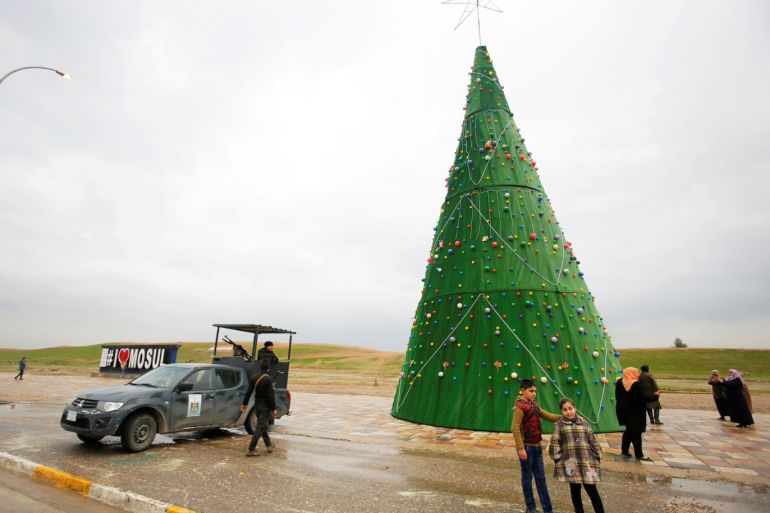 A Christmas tree is seen on a street during New Year celebrations, one year after defeat of Islamic State in Mosul, Iraq December 31, 2018. REUTERS/Khalid al-Mousily