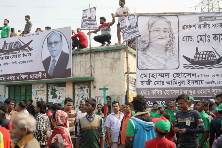 People stand on a rooftop as they join in a campaign of the Bangladesh Awami League, ahead of the 11th general election in Dhaka, Bangladesh, December 24, 2018. REUTERS/Mohammad Ponir Hossain