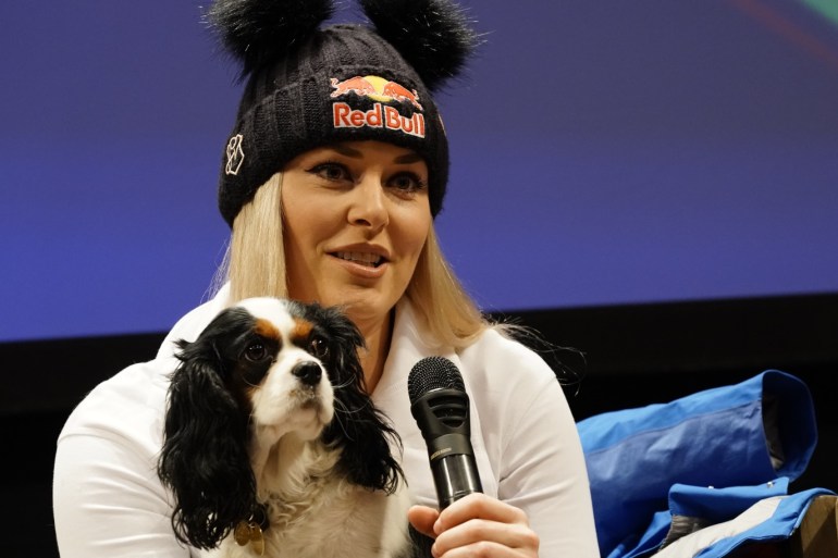 CORTINA D'AMPEZZO, ITALY - JANUARY 16 : Lindsey Vonn of USAand her dog Lucy at a press conference during the Audi FIS Alpine Ski World Cup Women's Downhill on January 16, 2019 in Cortina d'Ampezzo Italy. (Photo by Francis Bompard/Agence Zoom/Getty Images)