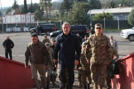 Turkish army, intelligence chiefs meet at south border- - HATAY, TURKEY - JANUARY 12: Turkey's Defense Minister Hulusi Akar (C) arrives to attend a meeting at Hatay border to discuss the latest developments in Syria's north and the efforts on maintaining the ceasefire in Idlib, in Hatay, Turkey on January 12, 2019.