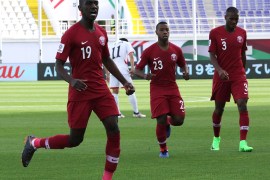 epa07279630 Almoez Ali (L) of Qatar celebrates a 1-0 goal during the 2019 AFC Asian Cup group E preliminary round match between Qatar and North Korea in Al Ain, United Arab Emirates, 13 January 2019. EPA-EFE/MAHMOUD KHALED