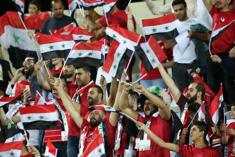 epa07265594 Syrian fans attend the 2019 AFC Asian Cup group B preliminary round match between Syria and Palestine in Sharjah, United Arab Emirates, 06 January 2019. EPA-EFE/MAHMOUD KHALED