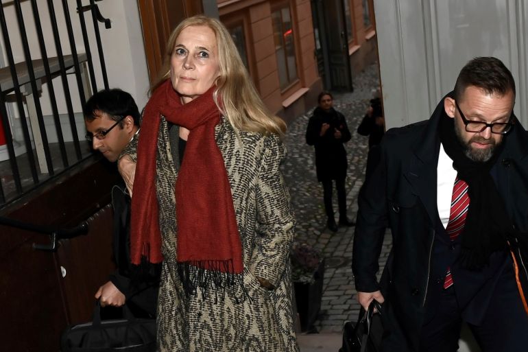 The member of the Swedish Academy and wife of Frenchman Jean-Claude Arnault, Katarina Frostenson (C), arrives to the Svea Hovratt appeal court together with laywer Bjorn Hurtig (R) and counsel Samuel Hartman (L) on the third day of Arnault's appeal trial in Stockholm, Sweden, November 14, 2018. Jonas Ekstromer/TT News Agency/via REUTERS ATTENTION EDITORS - THIS IMAGE WAS PROVIDED BY A THIRD PARTY. SWEDEN OUT. NO COMMERCIAL OR EDITORIAL SALES IN SWEDEN.