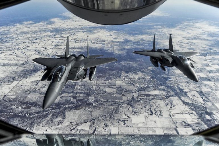 Two F-15E Strike Eagles wait to receive fuel from a KC-135R Stratotanker during exercise Red Flag 15-1 at Nellis Air Force Base, Nevada in this undated U.S. Air Force (USAF) picture released February 1, 2015. Red Flag is the Air Force's premiere air-to-air combat training exercise and includes both U.S. and allied nations' combat air forces, according to a USAF factsheet. REUTERS/USAF/Handout via Reuters (UNITED STATES - Tags: MILITARY) THIS IMAGE HAS BEEN SUPPLIED