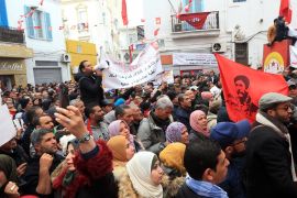 Tunisian labor union reaffirms plan for Thursday strike- - TUNIS, TUNISIA - JANUARY 14: Tunisians attend a rally marking the eighth anniversary of