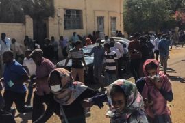 Anti-government demonstration in Sudan- - KHARTOUM, SUDAN - JANUARY 6 : Sudanese protesters,effected by tear gas, cover their faces during an anti-government demonstration in the capital Khartoum on January 6, 2018.