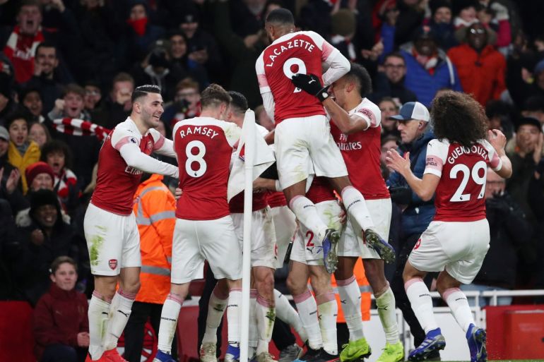 Soccer Football - Premier League - Arsenal v Chelsea - Emirates Stadium, London, Britain - January 19, 2019 Arsenal's Laurent Koscielny (hidden) celebrates scoring their second goal with team mates REUTERS/Hannah Mckay EDITORIAL USE ONLY. No use with unauthorized audio, video, data, fixture lists, club/league logos or