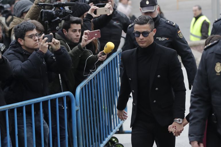 Cristian Ronaldo in court for tax evasion charge- - MADRID, SPAIN - JANUARY 22: Famous Portuguese football player Cristian Ronaldo arrives at provincial court with his girlfriend Georgina Rodriguez for his tax evasion trial in Madrid, Spain on January 22, 2019.