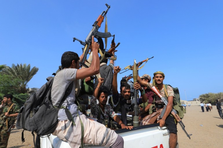 Houthi militants ride on the back of a truck as they withdraw, part of a U.N.-sponsored peace agreement signed in Sweden earlier this month, from the Red Sea city of Hodeidah, Yemen December 29, 2018. REUTERS/Abduljabbar Zeyad