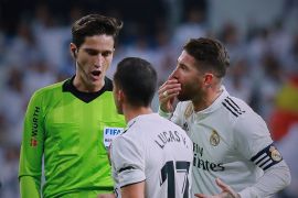 MADRID, SPAIN - JANUARY 06: Sergio Ramos (R) of Real Madrid CF and his teammate Lucas Vazquez (2ndR) protest to referee Jose Luis Munuera during the La Liga match between Real Madrid CF and Real Sociedad de Futbol at Estadio Santiago Bernabeu on January 06, 2019 in Madrid, Spain. (Photo by Gonzalo Arroyo Moreno/Getty Images)