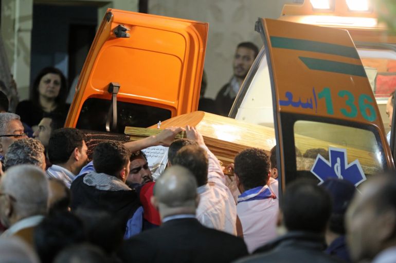 A coffin is carried out of an ambulance outside of the Coptic church that was bombed on Sunday in Tanta, Egypt, April 9, 2017. REUTERS/Mohamed Abd El Ghany