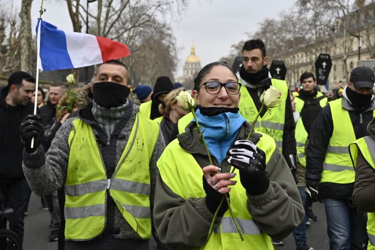 Yellow vest demonstration in Paris- - PARIS, FRANCE - JANUARY 19: French yellow vests (Gilets jaunes) protesters walk on the street as demonstration against deteriorating economic conditions in Paris, France on January 19, 2019.