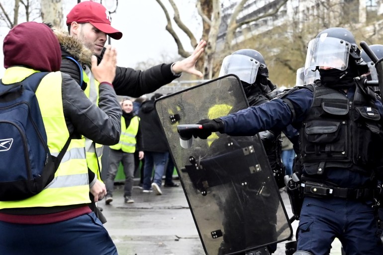 Yellow vest demonstration in Paris- - PARIS, FRANCE - JANUARY 26: Yellow vest (Gilets jaunes) protesters clash with French riot police at the Place de la Bastille during the 'Act XI' demonstration (the 11th consecutive national protest on a Saturday) in Pariss, France on January 26, 2019.