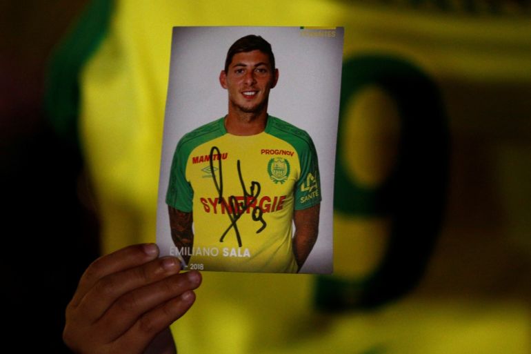 A fan holds a portrait of Emiliano Sala in Nantes' city center after news that newly-signed Cardiff City soccer player Emiliano Sala was missing after the light aircraft he was travelling in disappeared between France and England the previous evening, according to France's civil aviation authority, France, January 22, 2019. REUTERS/Stephane Mahe