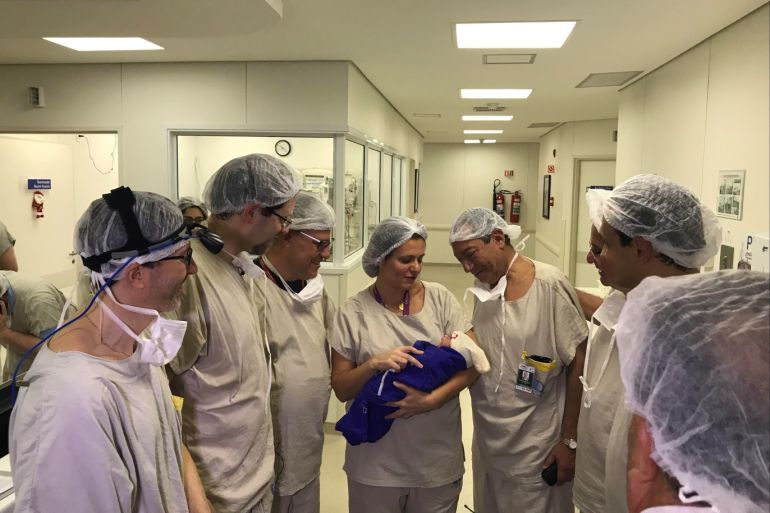 Medical team hold the first baby born via uterus transplant from a deceased donor at the hospital in Sao Paulo, Brazil December 15, 2017 in this picture handout obtained on December 4, 2018. Hospital das Clinicas da FMUSP/via REUTERS ATTENTION EDITORS - THIS IMAGE HAS BEEN SUPPLIED BY A THIRD PARTY. MANDATORY CREDIT.