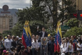 Mass Opposition Rally Against Nicolas Maduro in Caracas- - CARACAS, VENEZUELA - JANUARY 23: Juan Guaido (35), President of National Assembly shows the National Constitution as he declares himself interim president in front of hundreds of Venezuelan during a mass rally against Nicolas Maduro in Caracas, Venezuela on January 23, 2019.