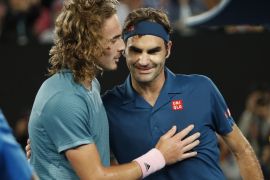 Tennis - Australian Open - Fourth Round - Melbourne Park, Melbourne, Australia, January 20, 2019. Switzerland’s Roger Federer and Greece’s Stefanos Tsitsipas greet each other after the match. REUTERS/Aly Song