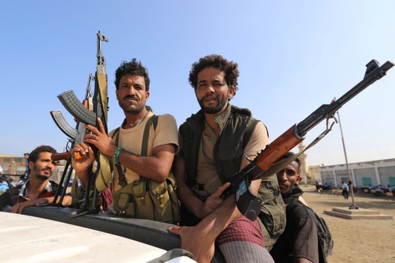 Houthi militants ride on the back of a truck as they withdraw, as part of a U.N.-sponsored peace agreement signed in Sweden earlier this month, from the Red Sea city of Hodeidah, Yemen December 29, 2018. REUTERS/Abduljabbar Zeyad