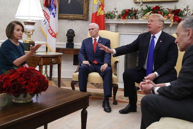 WASHINGTON, DC - DECEMBER 11: U.S. President Donald Trump (2R) argues about border security with Senate Minority Leader Chuck Schumer (D-NY) (R) and House Minority Leader Nancy Pelosi (D-CA) as Vice President Mike Pence sits nearby in the Oval Office on December 11, 2018 in Washington, DC. Mark Wilson/Getty Images/AFP== FOR NEWSPAPERS, INTERNET, TELCOS & TELEVISION USE ONLY ==