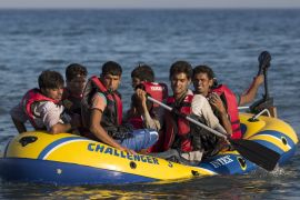 KOS, GREECE - AUGUST 28: Migrant men arrive in an inflatable dinghy on the beach at sunrise on the island of Kos after crossing a three mile stretch of the Aegean Sea from Turkey on August 28, 2015 in Kos, Greece. Migrants from the Middle East and North Africa continue to flood into Europe at a rate that marks the largest migration since World War II. (Photo by Dan Kitwood/Getty Images)