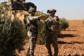U.S. and Turkish soldiers discuss details during the first-ever combined joint patrol in Manbij, Syria, November 1, 2018. Picture taken November 1, 2018. Courtesy Arnada Jones/U.S. Army/Handout via REUTERS ATTENTION EDITORS - THIS IMAGE HAS BEEN SUPPLIED BY A THIRD PARTY.