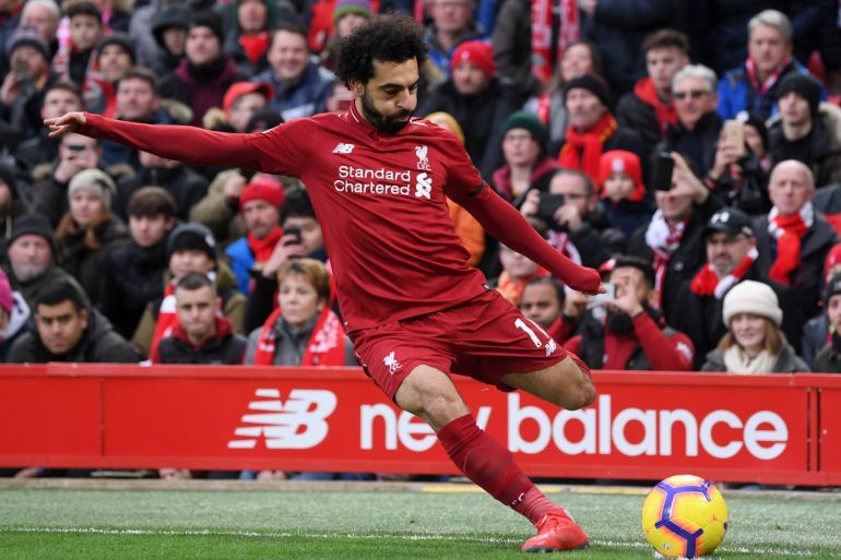 LIVERPOOL, ENGLAND - JANUARY 19: Mohamed Salah of Liverpool takes a corner during the Premier League match between Liverpool FC and Crystal Palace at Anfield on January 19, 2019 in Liverpool, United Kingdom. (Photo by Laurence Griffiths/Getty Images)