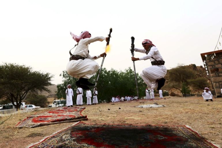 Men dance during a traditional excursion near the western Saudi city of Taif, August 8, 2015. Saudis usually party in such excursions as they celebrate weddings or graduations. REUTERS/Mohamed Al Hwaity