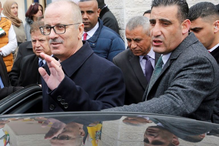 Palestinian Prime Minister Rami Hamdallah waves as he leaves after attending the opening ceremony of a health center near Hebron, in the Israeli-occupied West Bank January 28, 2019. REUTERS/Mussa Qawasma