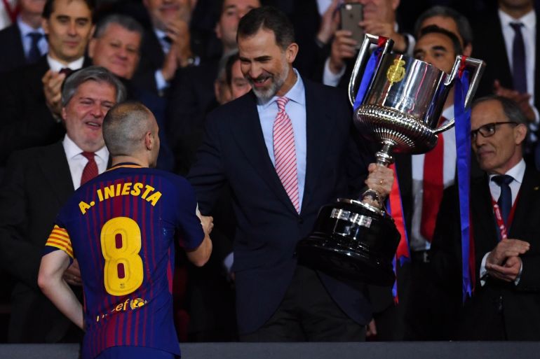 BARCELONA, SPAIN - APRIL 21: Andres Iniesta of FC Barcelona shakes hands with King Felipe VI of Spain before lifting the trophy after winning with his team the Spanish Copa del Rey Final match between Barcelona and Sevilla at Wanda Metropolitano stadium on April 21, 2018 in Barcelona, Spain. (Photo by David Ramos/Getty Images)