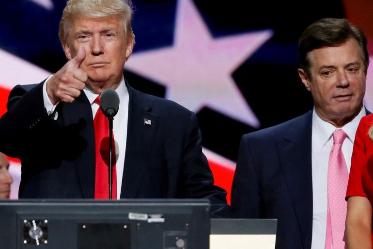 FILE PHOTO: Republican presidential nominee Donald Trump gives a thumbs up as his campaign manager Paul Manafort looks on during Trump's walk through at the Republican National Convention in Cleveland, U.S., July 21, 2016. Picture taken July 21, 2016. REUTERS/Rick Wilking/File Photo