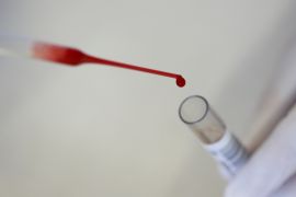 A laboratory technician tests donor blood in the 'Bayerisches Rotes Kreuz' blood transfusion service laboratory in Munich, Germany, September 5, 2016. REUTERS/Michaela Rehle