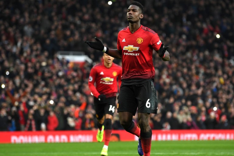 MANCHESTER, ENGLAND - JANUARY 19: Paul Pogba of Manchester United celebrates after scoring his team's first goal during the Premier League match between Manchester United and Brighton & Hove Albion at Old Trafford on January 19, 2019 in Manchester, United Kingdom. (Photo by Gareth Copley/Getty Images)