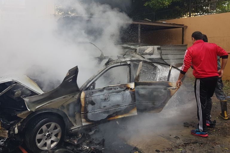 Explosion in Lebanon- - SIDON, LEBANON - JANUARY 14: Smoke rises from parked vehicle belonging to Muhammed Hamdan, who is allegedly member of Hamas, after it exploded in Sidon, Lebanon on January 14, 2018.