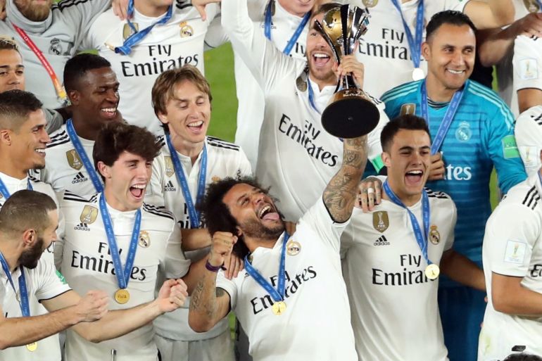 Soccer Football - Club World Cup - Final - Real Madrid v Al Ain - Zayed Sports City Stadium, Abu Dhabi, United Arab Emirates - December 22, 2018 Real Madrid players celebrate with the trophy after winning the Club World Cup REUTERS/Ahmed Jadallah TPX IMAGES OF THE DAY