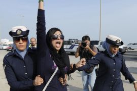 A file photograph dated 21 October 2012, shows rights activist Zainab Al-Khawaja (C) reacting as two police women arrest her, during a march toward Eker village, southwest of Manama, Bahrain. According to media reports, Al-Khawaja was released on 14 February 2014 after a year in prison for insulting and humiliating a public employee.