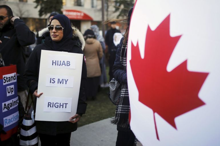 A woman holds a sign during a solidarity march in Toronto November 20, 2015. The march was organized to show solidarity for two Muslim woman were allegedly verbally assaulted on the Toronto subway system on Wednesday, according to local media. REUTERS/Mark Blinch
