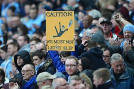 MANCHESTER, ENGLAND - MAY 07: A Manchester City fan holds a message for his team referencing Steven Gerrard's slip against Chelsea during the Barclays Premier League match between Manchester City and Aston Villa at Etihad Stadium on May 7, 2014 in Manchester, England. (Photo by Michael Regan/Getty Images)