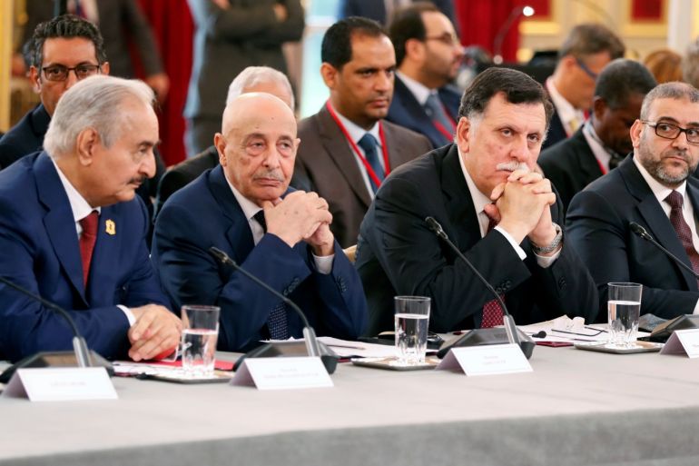 (L-R) Khalifa Haftar, the military commander who dominates eastern Libya, Aguila Saleh Issa, president of the eastern Libyan House of Representatives, Libyan Prime Minister Fayez al-Sarraj and Khaled Al-Mishri, president of Libya High Council of State, during an international conference on Libya at the Elysee Palace in Paris, France, May 29, 2018. Etienne Laurent/Pool via Reuters