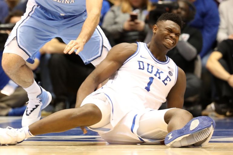 DURHAM, NORTH CAROLINA - FEBRUARY 20: Zion Williamson #1 of the Duke Blue Devils reacts after falling as his shoe breaks in the first half of the game against the North Carolina Tar Heels at Cameron Indoor Stadium on February 20, 2019 in Durham, North Carolina. Streeter Lecka/Getty Images/AFP== FOR NEWSPAPERS, INTERNET, TELCOS & TELEVISION USE ONLY ==