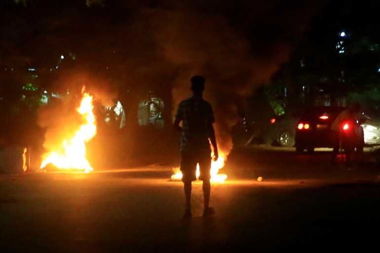 Protesters set fires along a street in Khartoum, Sudan February 23, 2019. REUTERS/Mohamed Nureldin Abdallah