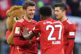 Soccer Football - Bundesliga - Bayern Munich v Hertha BSC - Allianz Arena, Munich, Germany - February 23, 2019 Bayern Munich's Thomas Mueller celebrates with David Alaba at the end of the match REUTERS/Andreas Gebert DFL regulations prohibit any use of photographs as image sequences and/or quasi-video
