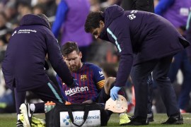 BARCELONA, SPAIN - FEBRUARY 02: Lionel Messi of Barcelona receives medical treatment during the La Liga match between FC Barcelona and Valencia CF at Camp Nou on February 2, 2019 in Barcelona, Spain. (Photo by Alex Caparros/Getty Images)