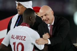 ABU DHABI, UNITED ARAB EMIRATES - FEBRUARY 01: Gianni Infantino, president of FIFA congratulates Almoez Ali of Qatar following the AFC Asian Cup final match between Japan and Qatar at Zayed Sports City Stadium on February 01, 2019 in Abu Dhabi, United Arab Emirates. (Photo by Francois Nel/Getty Images)