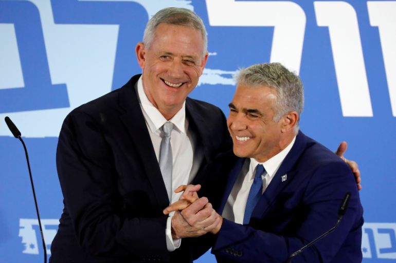 Benny Gantz, head of Resilience party and Yair Lapid, head of Yesh Atid, hold a news conference to announce the formation of their joint party, following an alliance between their parties, in Tel Aviv, Israel February 21, 2019. REUTERS/Amir Cohen