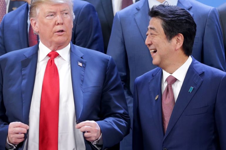 BUENOS AIRES, ARGENTINA - NOVEMBER 30: (L-R) President of U.S. President Donald Trump and Prime Minister of Japan Shinzo Abe talk during the family photo opening day of Argentina G20 Leaders' Summit 2018 at Costa Salguero on November 30, 2018 in Buenos Aires, Argentina. (Photo by Daniel Jayo/Getty Images)