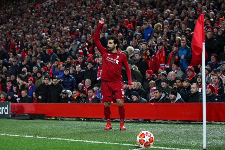LIVERPOOL, ENGLAND - FEBRUARY 19: Mohamed Salah of Liverpool prepares to take a corner during the UEFA Champions League Round of 16 First Leg match between Liverpool and FC Bayern Muenchen at Anfield on February 19, 2019 in Liverpool, England. (Photo by Clive Brunskill/Getty Images)