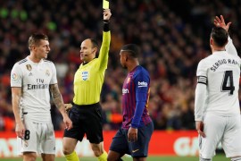 Soccer Football - Copa del Rey - Semi Final First Leg - FC Barcelona v Real Madrid - Camp Nou, Barcelona, Spain - February 6, 2019 Real Madrid's Sergio Ramos is shown a yellow card by referee Antonio Miguel Mateu Lahoz REUTERS/Albert Gea